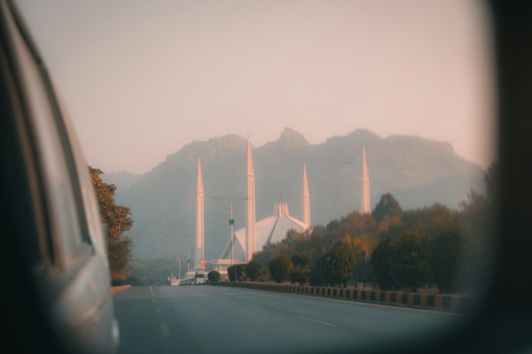 Faisal Mosque and Margalla Hills viewed from a car in Islamabad